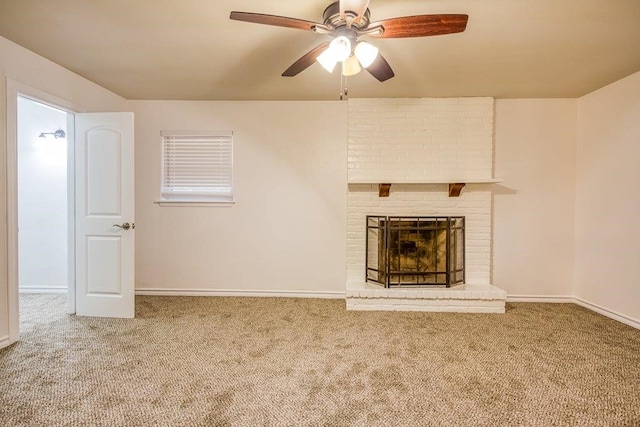 unfurnished living room featuring carpet flooring, ceiling fan, and a brick fireplace