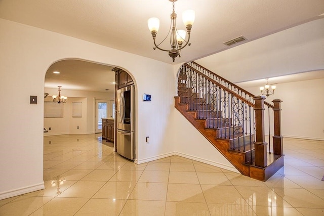 stairs with tile patterned floors