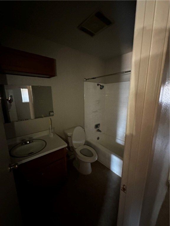 full bathroom with shower / bathing tub combination, vanity, and toilet