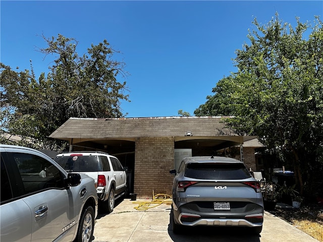 view of front of property featuring a carport