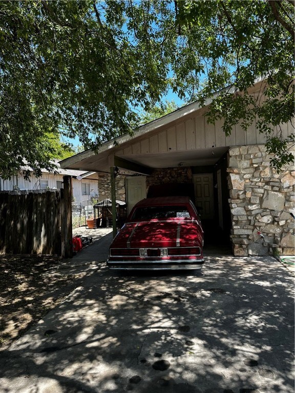 view of parking featuring a carport