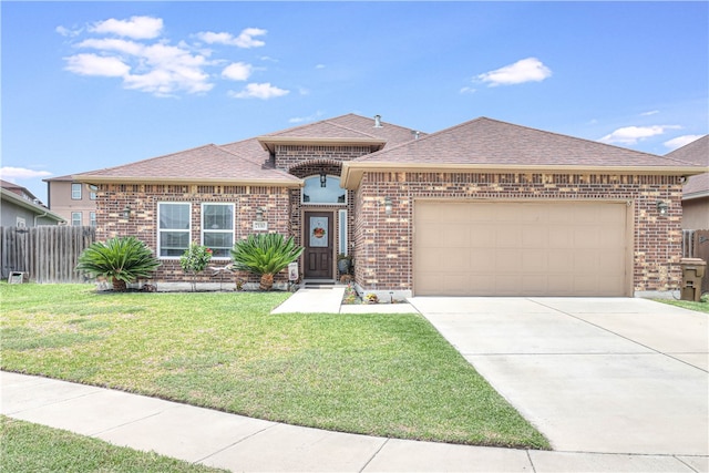 view of front facade with a garage and a front yard