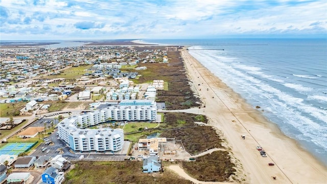 drone / aerial view with a beach view and a water view