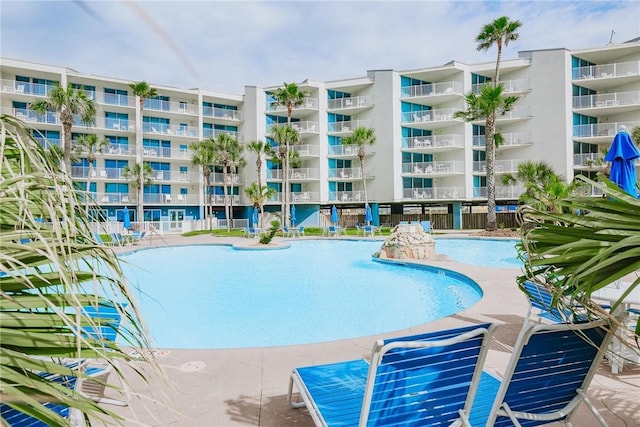 view of swimming pool with a patio