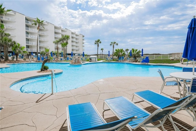 view of pool featuring a patio