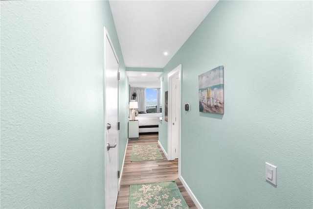 hallway featuring hardwood / wood-style floors