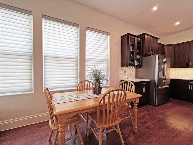 dining space featuring dark wood-type flooring, recessed lighting, and baseboards