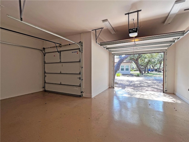 garage featuring baseboards and a garage door opener