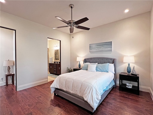 bedroom with wood finished floors, baseboards, recessed lighting, ceiling fan, and ensuite bathroom