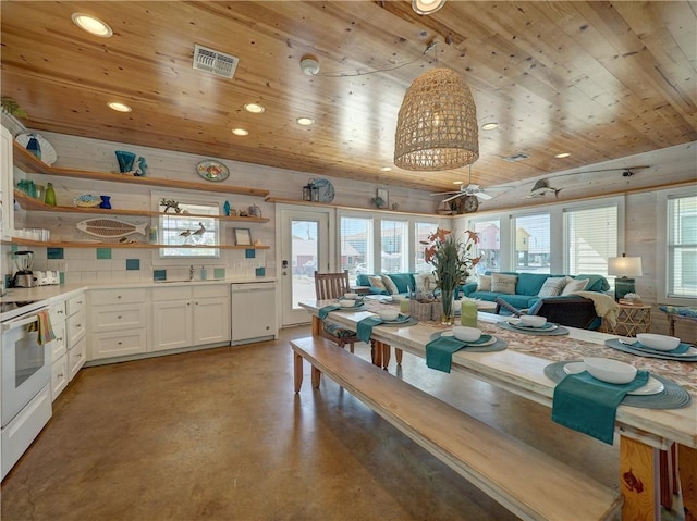 dining area with sink and wood ceiling