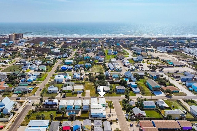 aerial view featuring a water view and a beach view