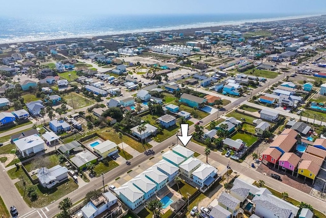 aerial view featuring a water view and a beach view