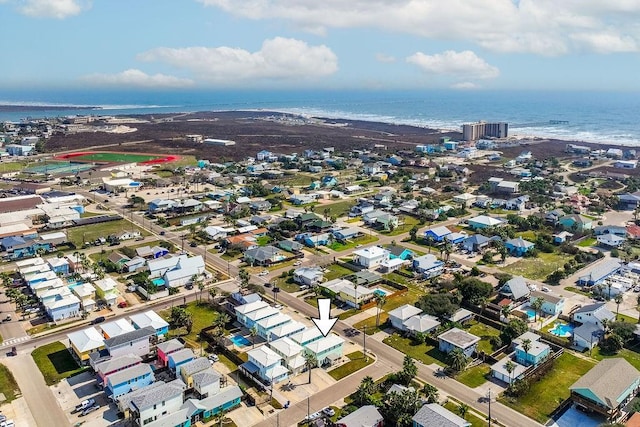 birds eye view of property featuring a view of the beach and a water view