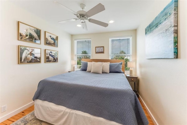 bedroom with hardwood / wood-style flooring and ceiling fan