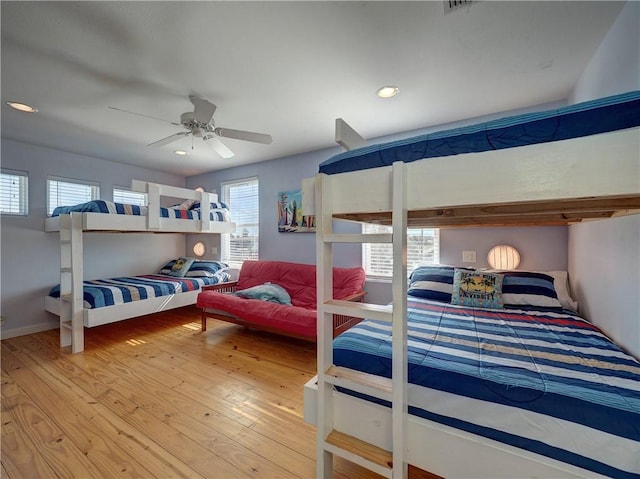 bedroom featuring wood-type flooring and ceiling fan