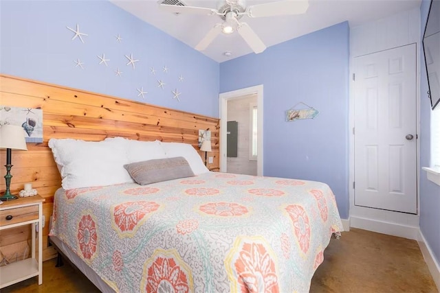 bedroom with ceiling fan and dark colored carpet