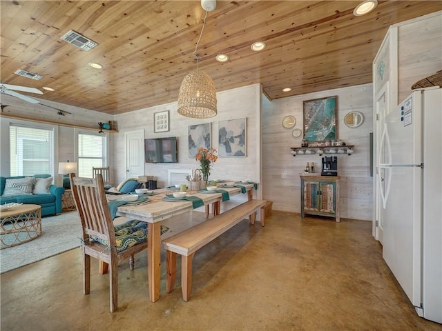 dining space with wood ceiling and ceiling fan