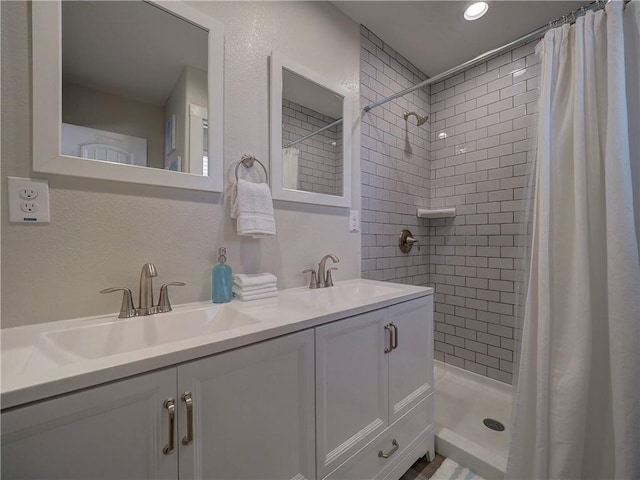 bathroom featuring vanity and walk in shower