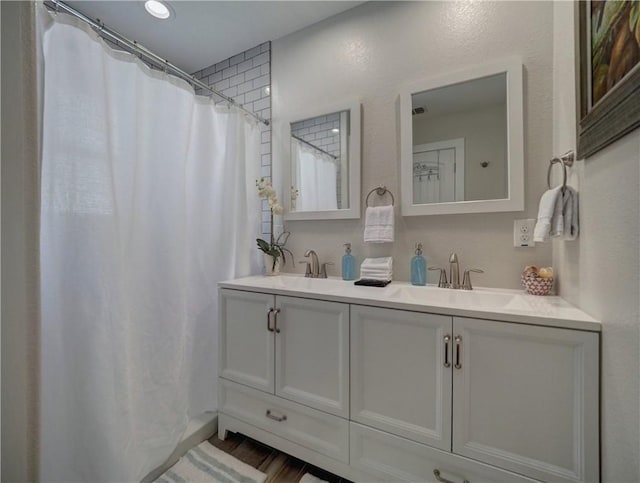 bathroom with vanity and a shower with shower curtain