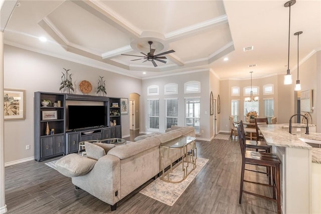 living area with dark wood-style flooring, visible vents, baseboards, and ceiling fan with notable chandelier