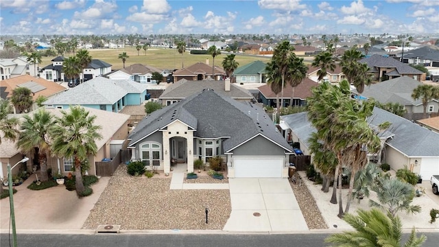 birds eye view of property with a residential view