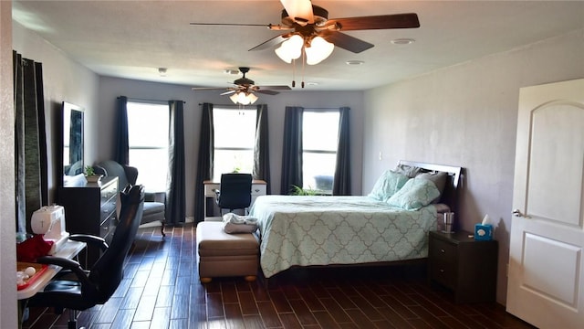 bedroom featuring ceiling fan and dark hardwood / wood-style flooring