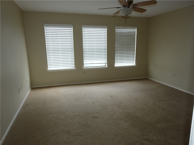 unfurnished room with light carpet and ceiling fan