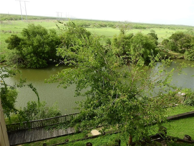 drone / aerial view featuring a water view and a rural view