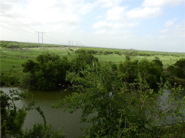 aerial view with a rural view and a water view