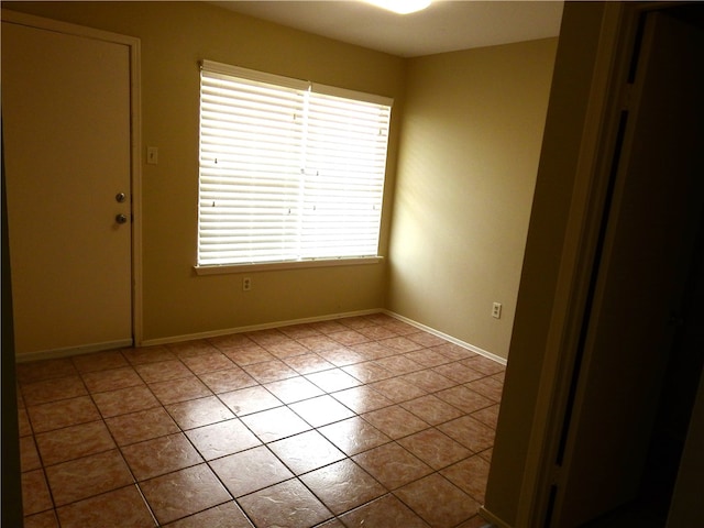 spare room with light tile patterned flooring