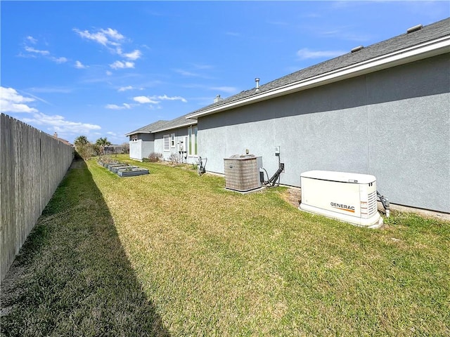 view of yard featuring cooling unit and fence