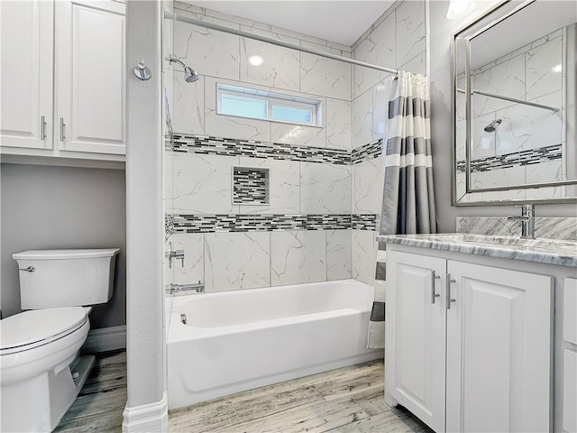 full bath with toilet, wood finished floors, vanity, and shower / bath combination with curtain