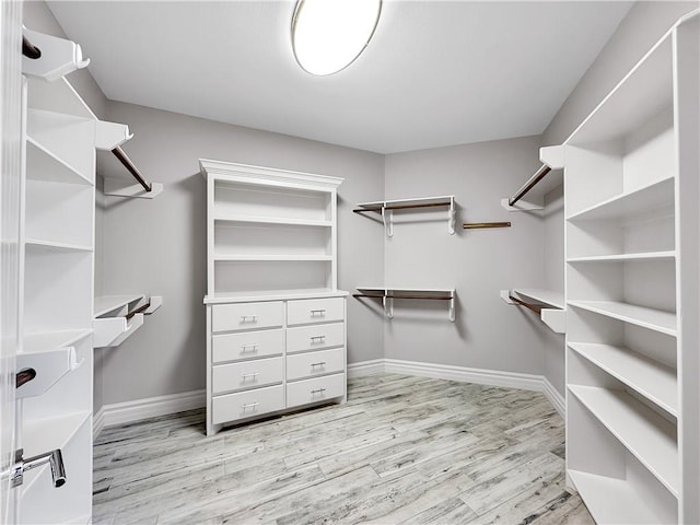 walk in closet featuring light wood finished floors