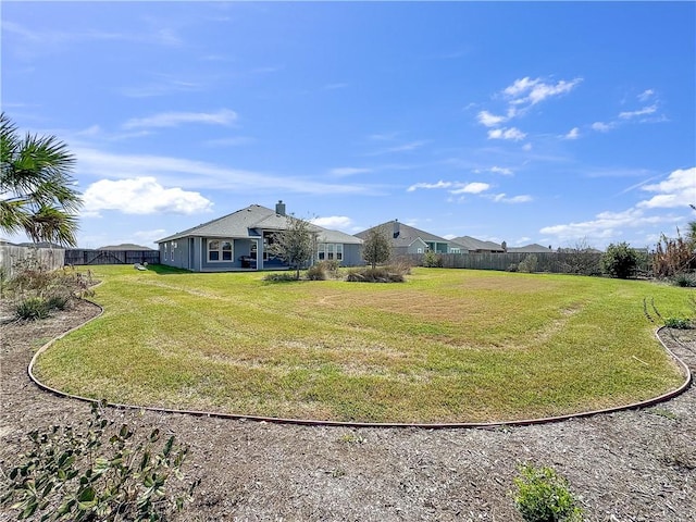 view of yard featuring fence