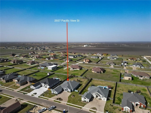 birds eye view of property with a residential view