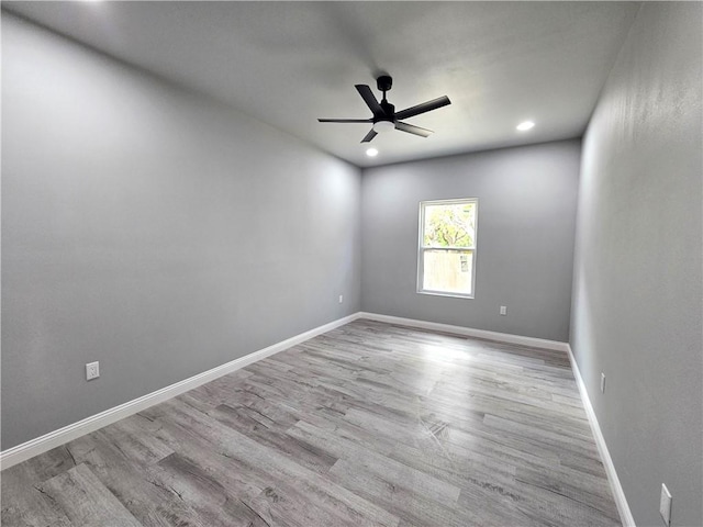unfurnished room featuring baseboards, recessed lighting, ceiling fan, and wood finished floors