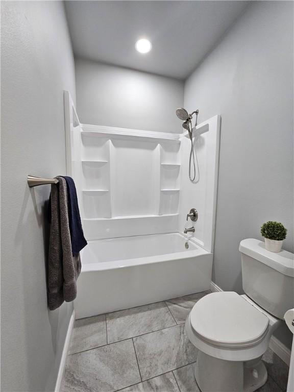 full bath with toilet, baseboards, and bathing tub / shower combination