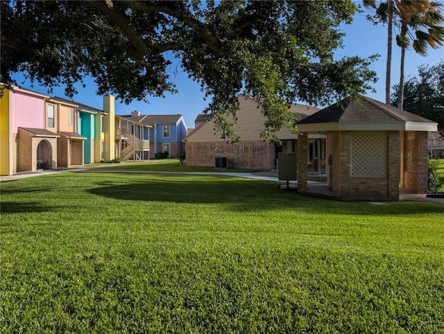 6702 Everhart Rd Unit 104, Corpus Christi, TX 78413 - view of grassy yard featuring a residential view