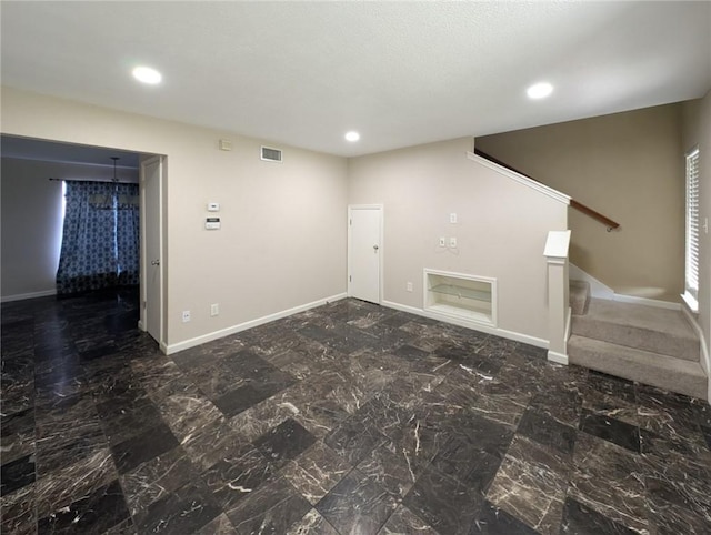 6702 Everhart Rd Unit 104, Corpus Christi, TX 78413 - unfurnished living room featuring stairway and recessed lighting