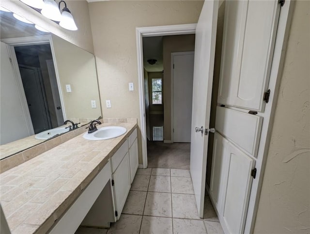6702 Everhart Rd Unit 104, Corpus Christi, TX 78413 - bathroom with vanity and tile patterned flooring