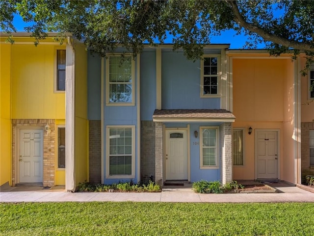 6702 Everhart Rd Unit 104, Corpus Christi, TX 78413 - view of property featuring a front yard and brick siding