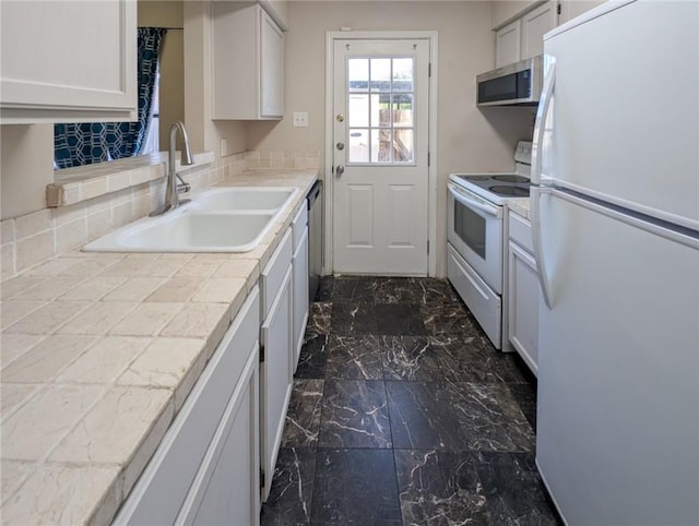 6702 Everhart Rd Unit 104, Corpus Christi, TX 78413 - kitchen with white appliances, tile counters, white cabinets, dark marble finish floors, and backsplash