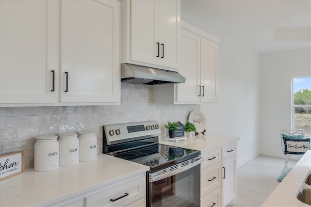 kitchen with white cabinets, stainless steel range with electric stovetop, and range hood