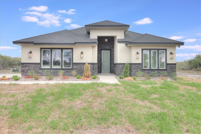 prairie-style home with a front yard