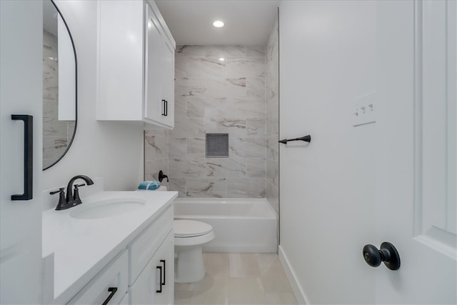 full bathroom with vanity, toilet, and tiled shower / bath