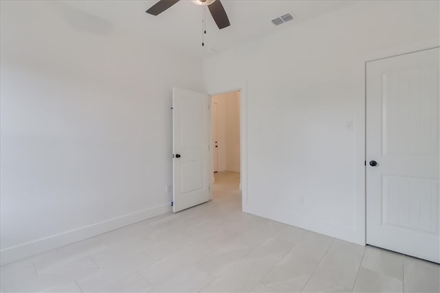 interior space with ceiling fan