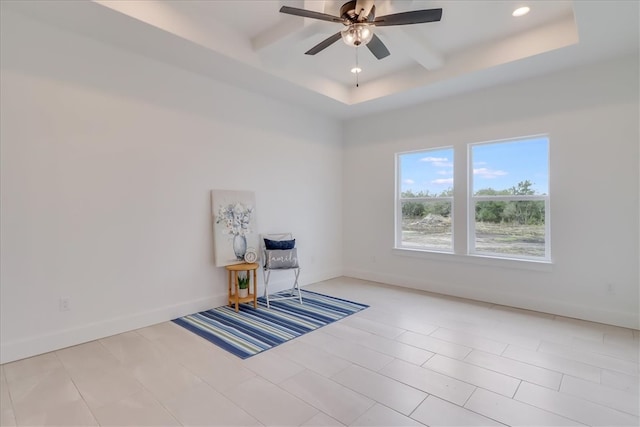 unfurnished room featuring a tray ceiling, ceiling fan, beamed ceiling, and light tile patterned floors