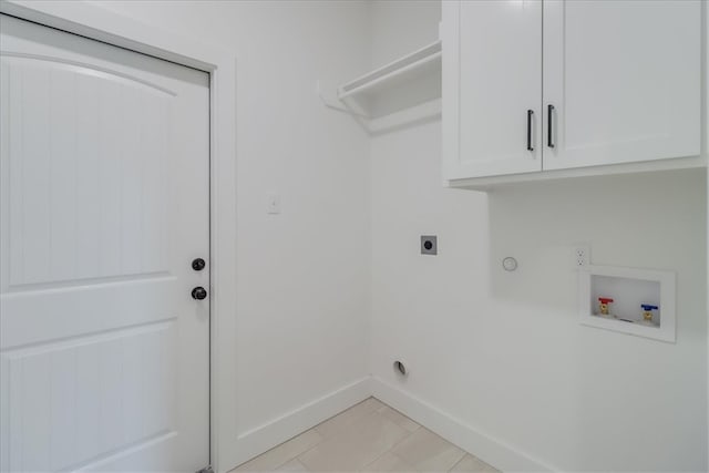 laundry area featuring cabinets, washer hookup, electric dryer hookup, gas dryer hookup, and light tile patterned flooring