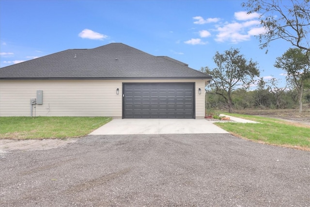 view of side of property featuring a garage