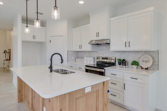 kitchen with white cabinetry, sink, hanging light fixtures, stainless steel electric stove, and a kitchen island with sink